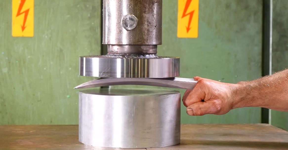 Crushing_Adamantium_with_Hydraulic_Press.jpg